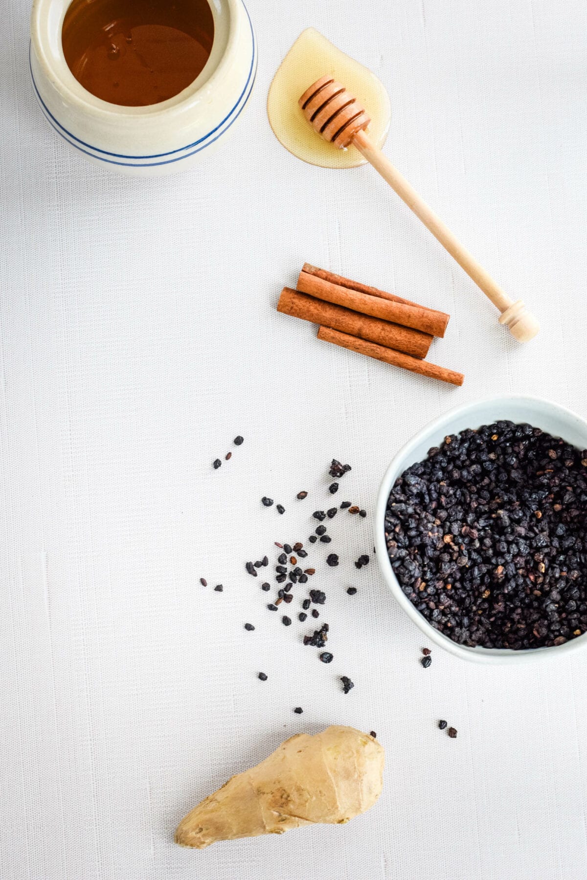 ingredients for elderberry syrup on a tabletop.