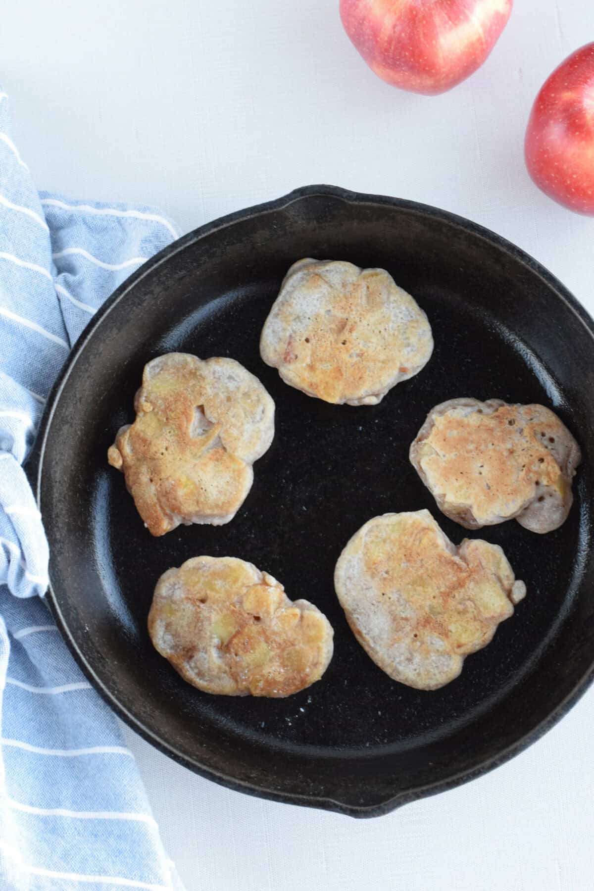 cast iron skillet with sourdough apple fritters