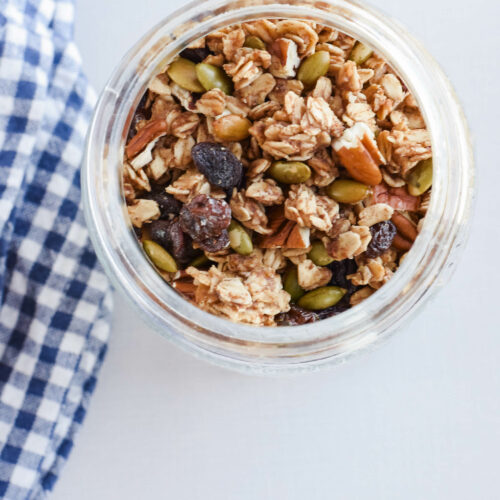 glass jar filled with finished pumpkin spice sourdough granola.