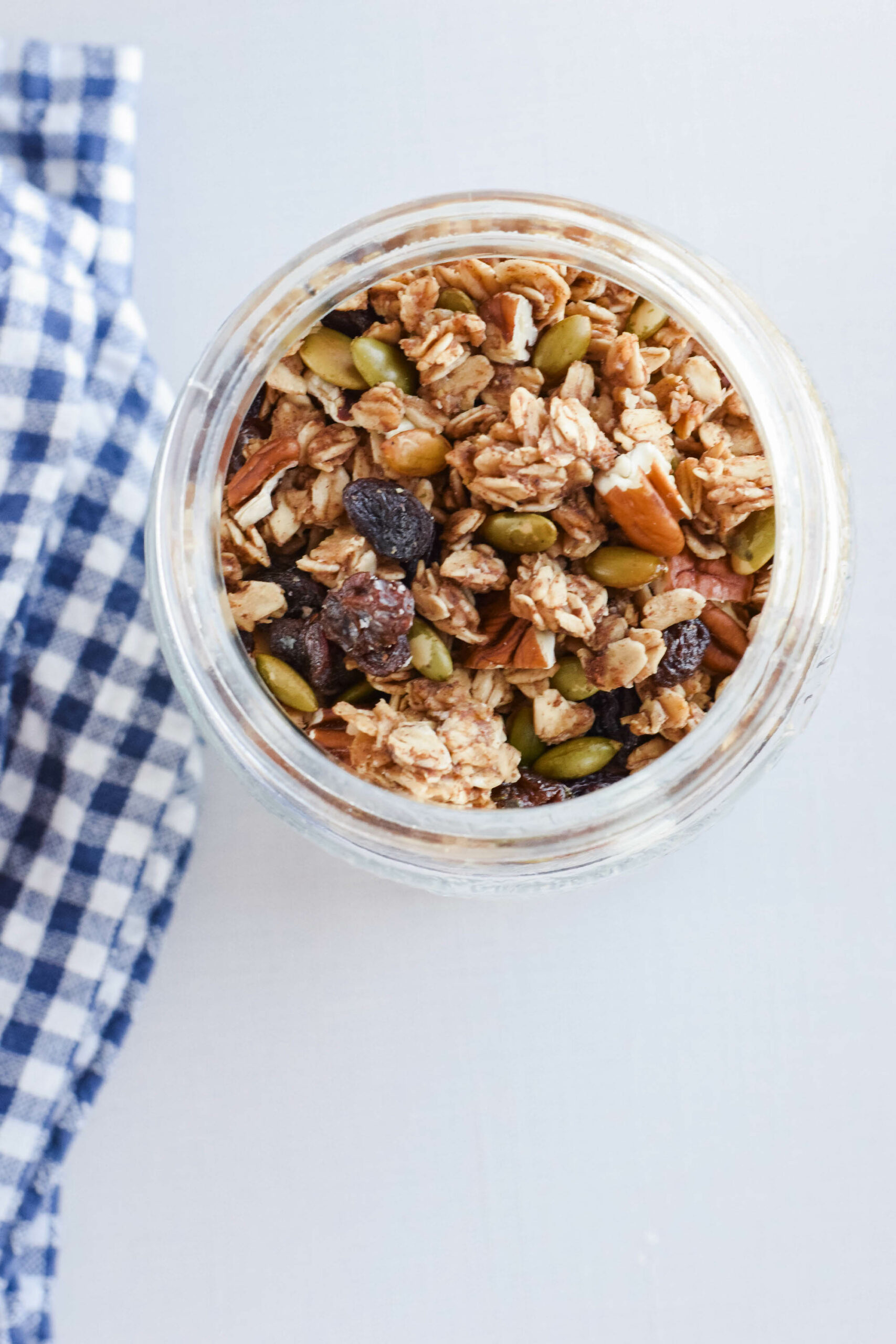 glass jar filled with finished pumpkin spice sourdough granola.