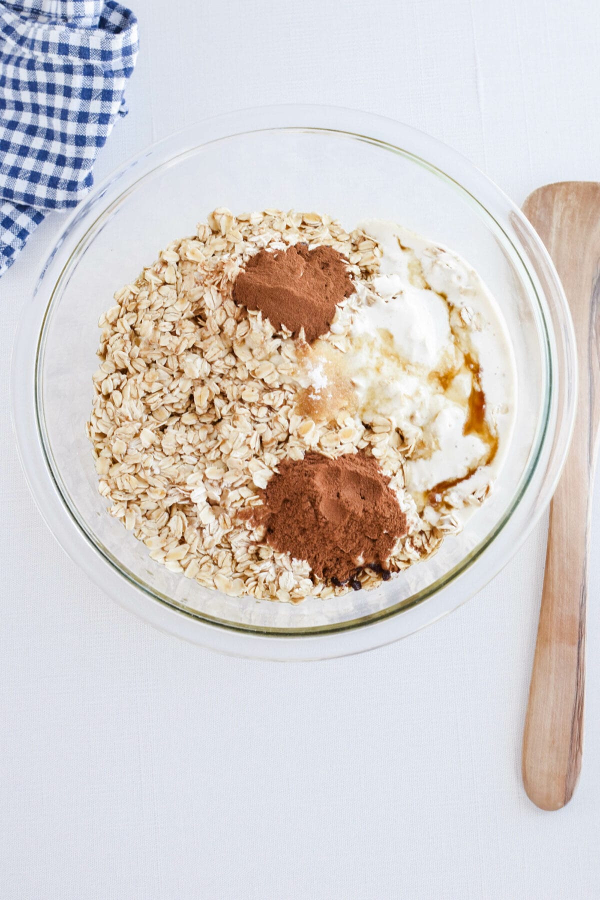 large mixing bowl with the ingredients for the pumpkin spice sourdough granola. 