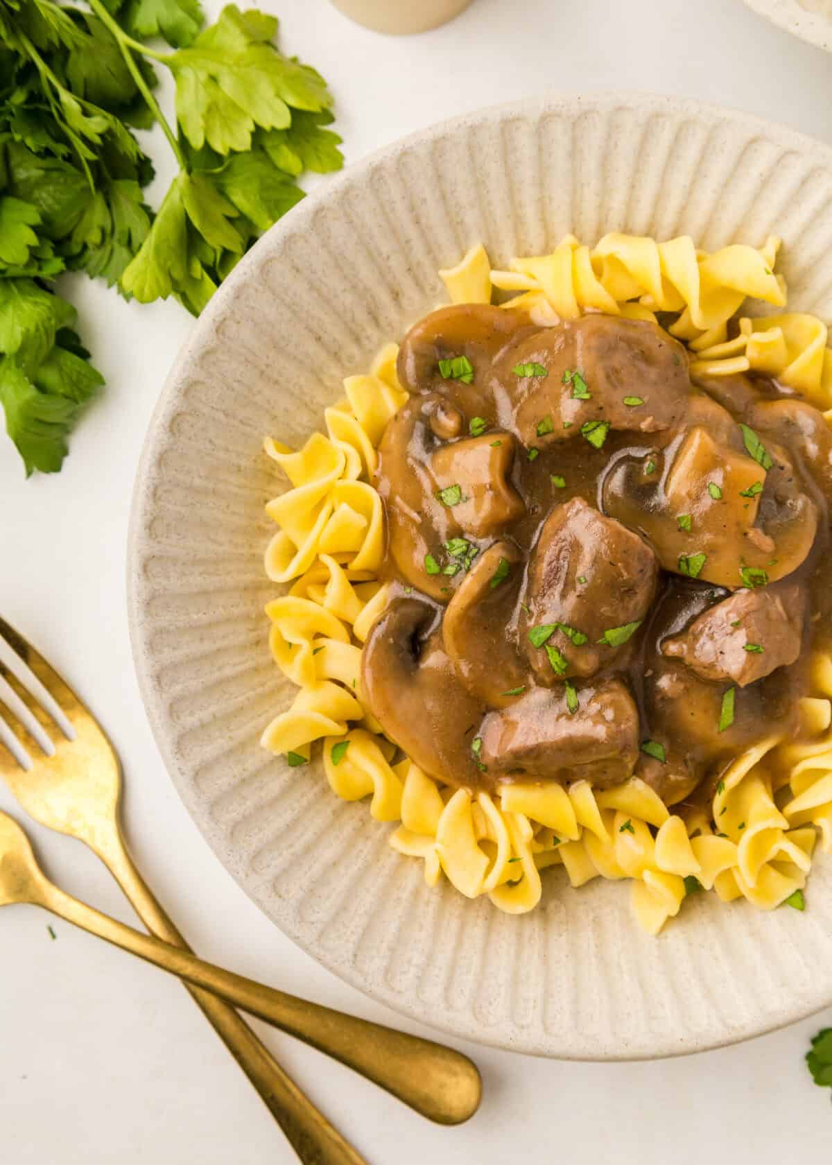 beef tips gravy over egg noodles. 