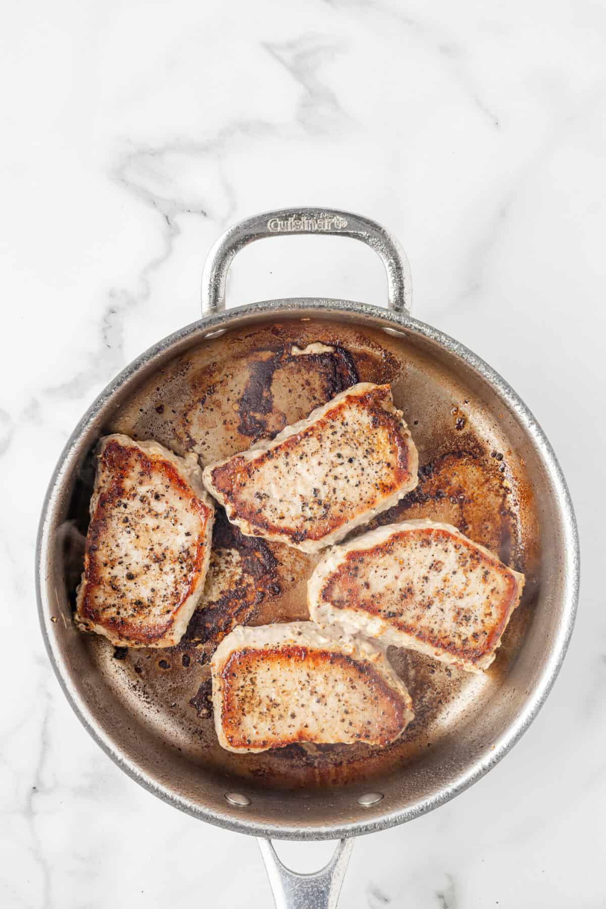 pork chops after cooking in the skillet.