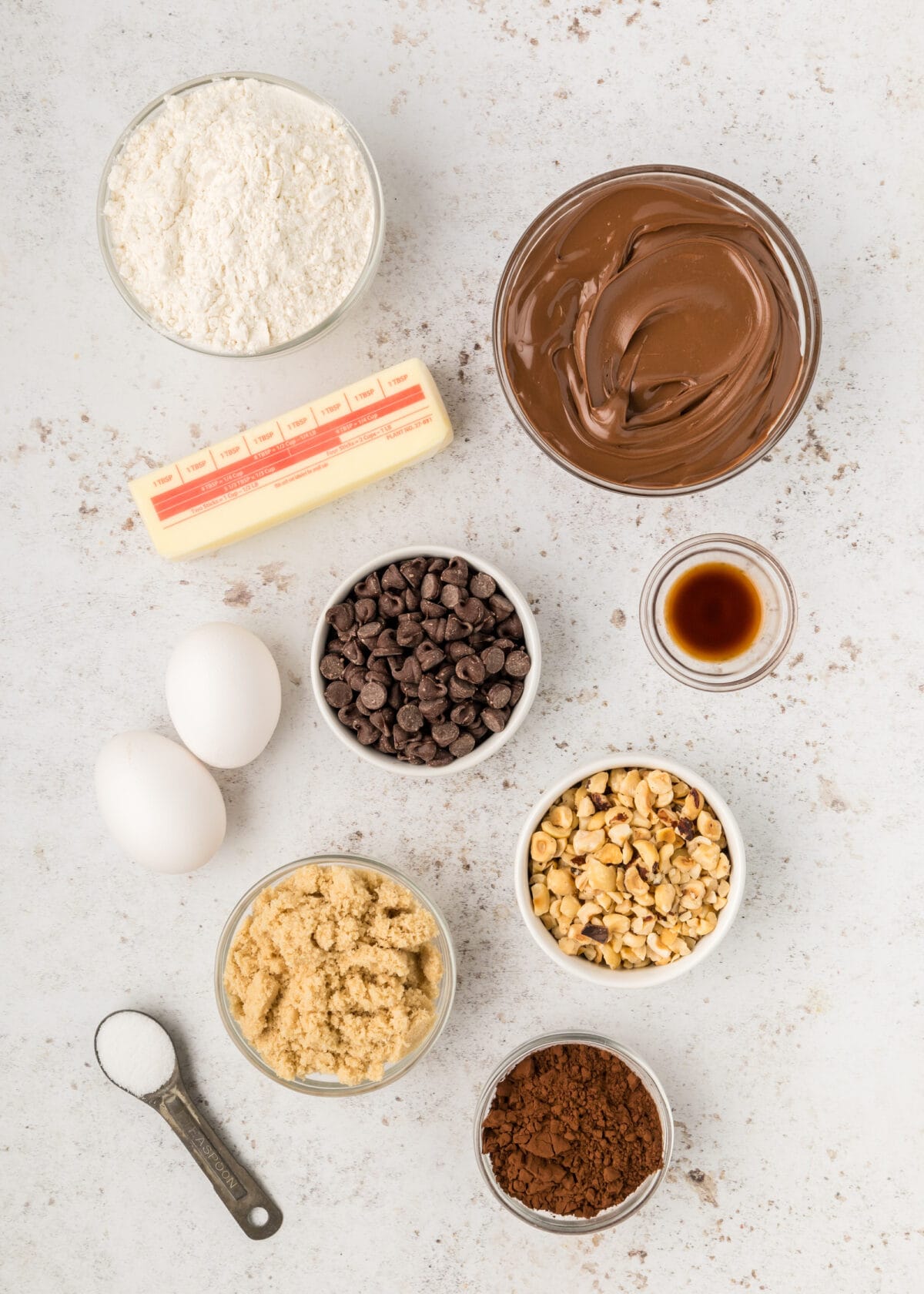 ingredients for the Nutella brownies in small bowls on a counter top. 