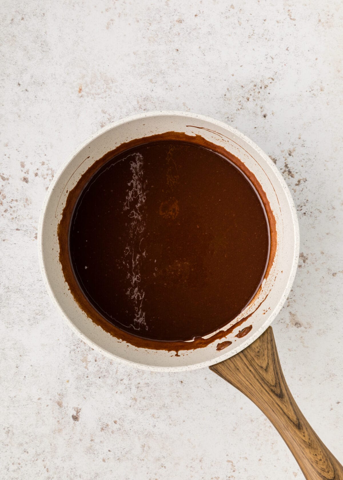 small saucepan with melted chocolate, butter and sugar. 