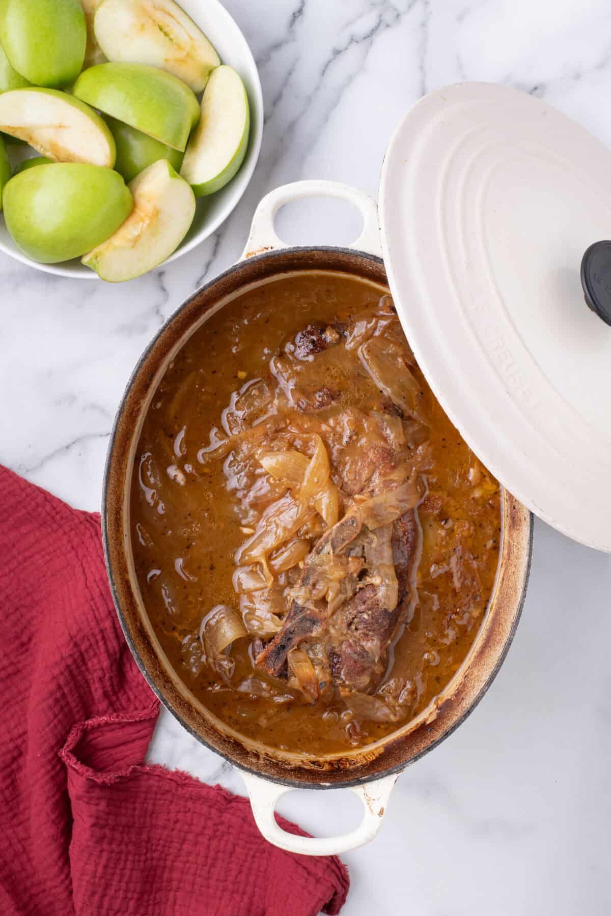 pork shoulder roast in a dutch oven after braising for 3 1/2 hours in the oven. 