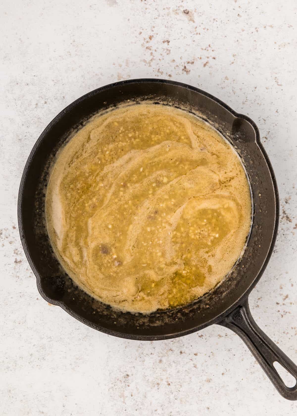 melted butter in the cast iron skillet.