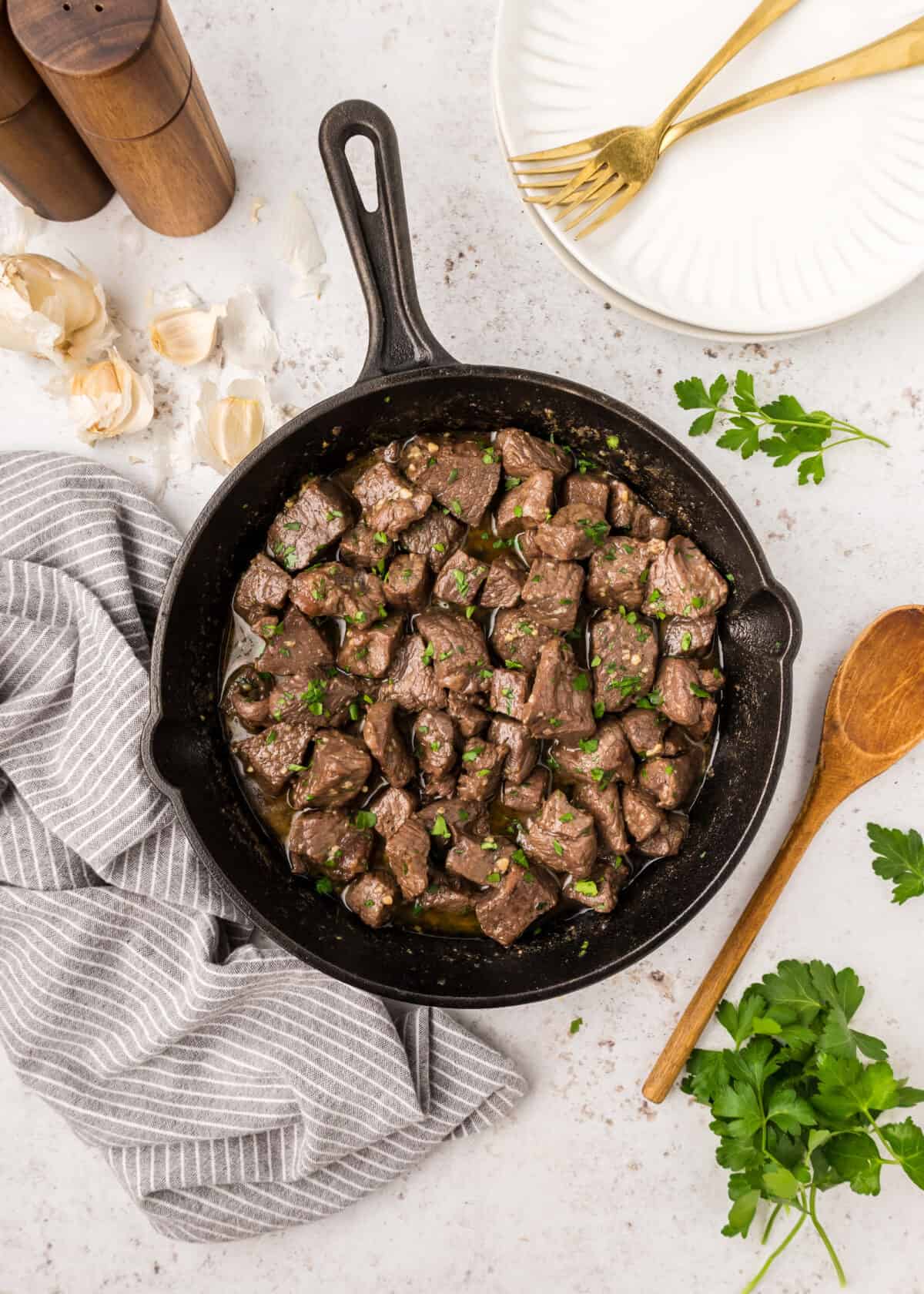 garlic butter steak bites in a large cast iron skillet. 