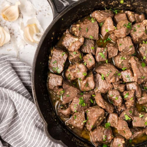 garlic butter steak bites in a large cast iron skillet.