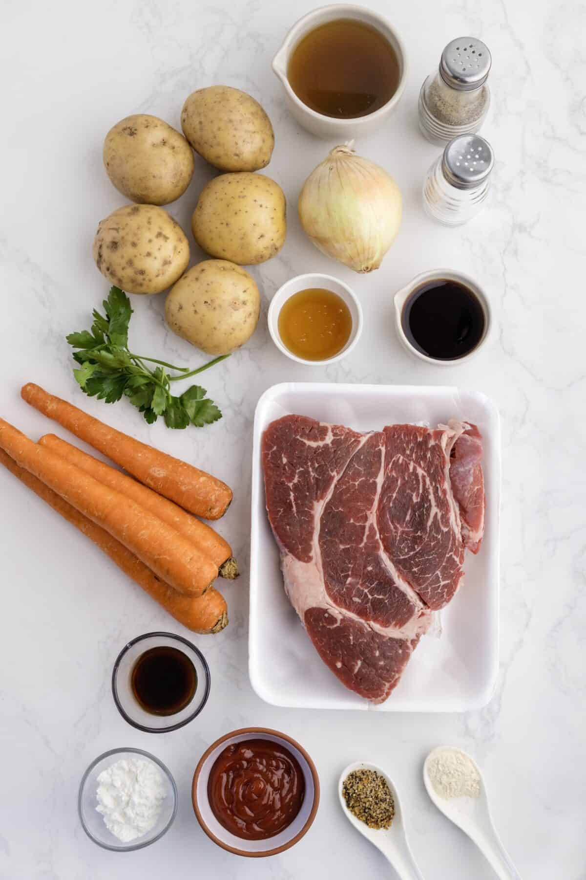 ingredients for the honey balsamic beef stew in small jars and resting on the countertop.