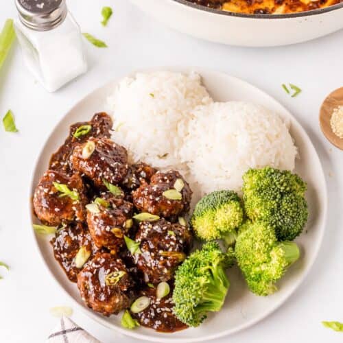 large white plate with Mongolian meatballs, steamed broccoli, and white rice.