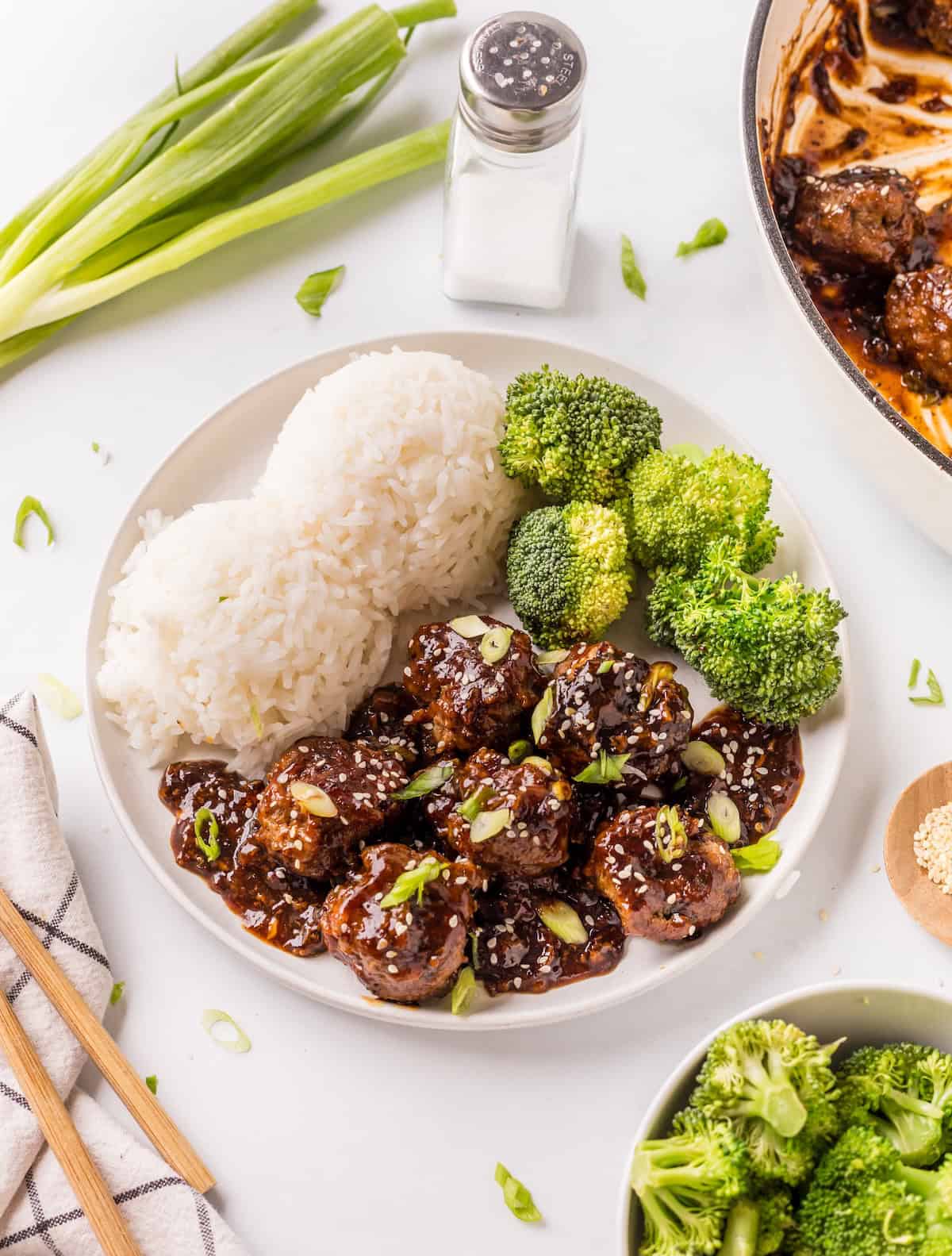 White bowl filled with the finished Mongolian Meatballs, white rice, and steamed broccoli.