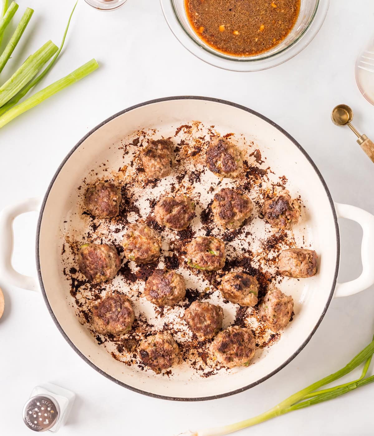 meatballs in a skillet.