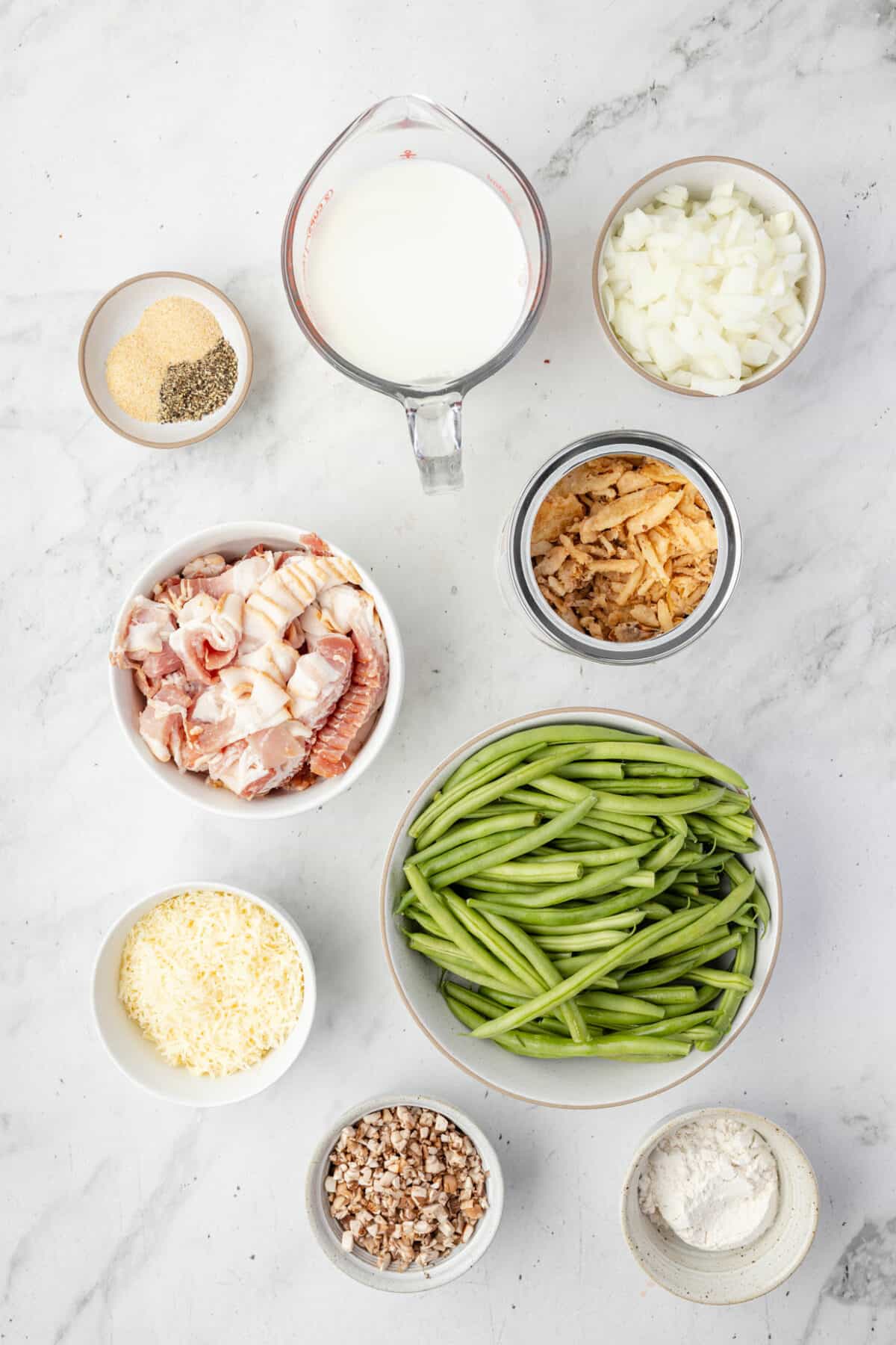 ingredients for the fresh green bean casserole in small bowls. 