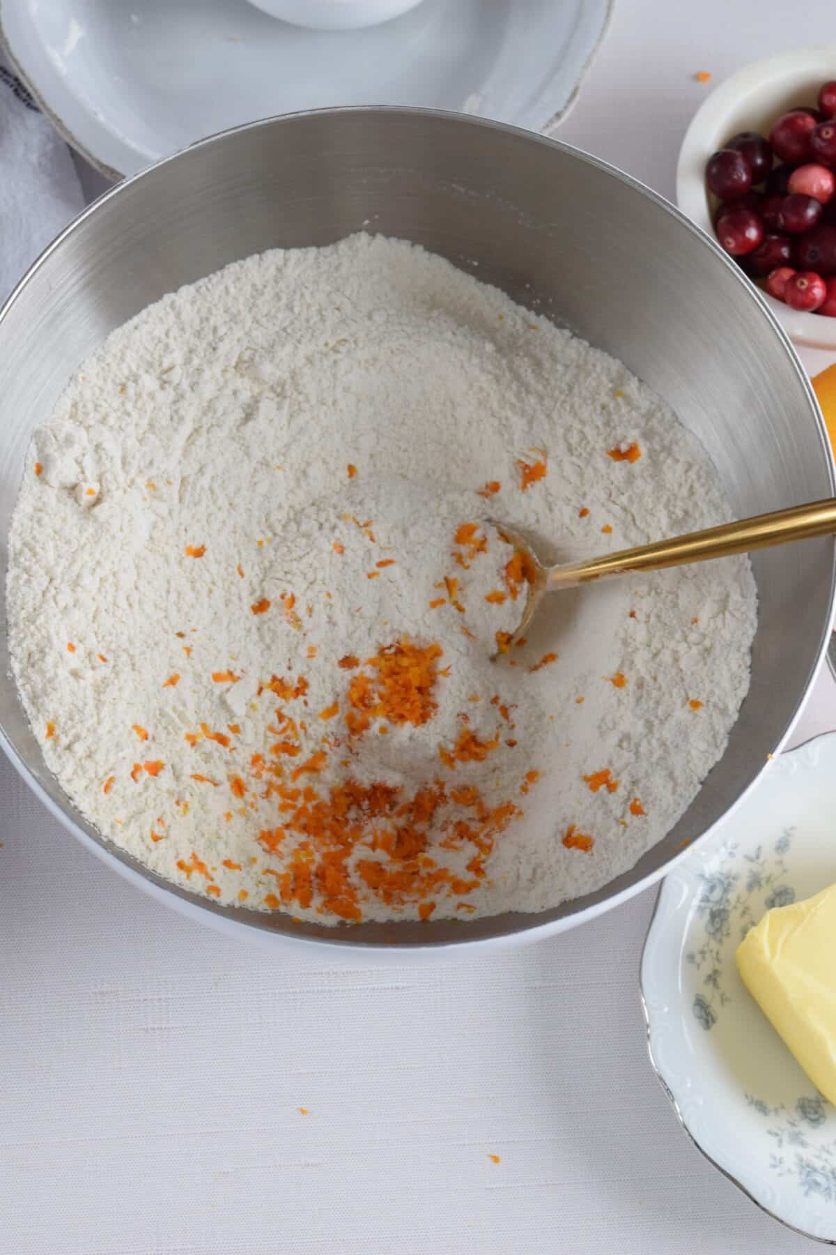 flour and orange zest in a bowl.