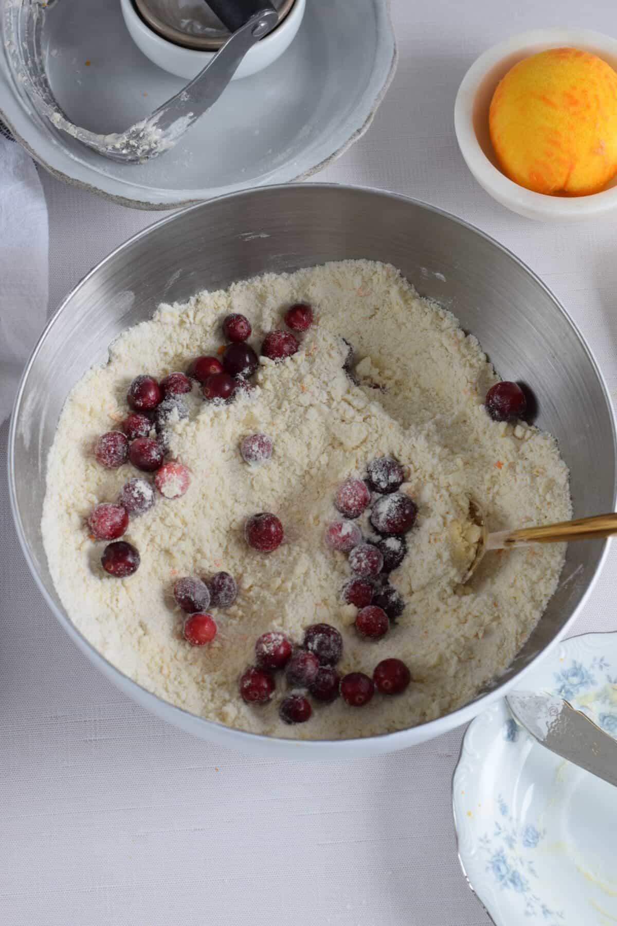 flour mixture with fresh cranberries.