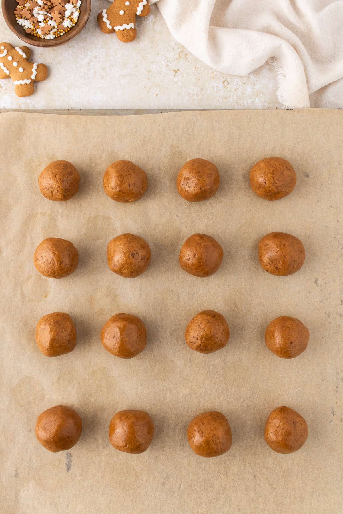 gingerbread truffle balls on a parchment paper lined cookie sheet. 