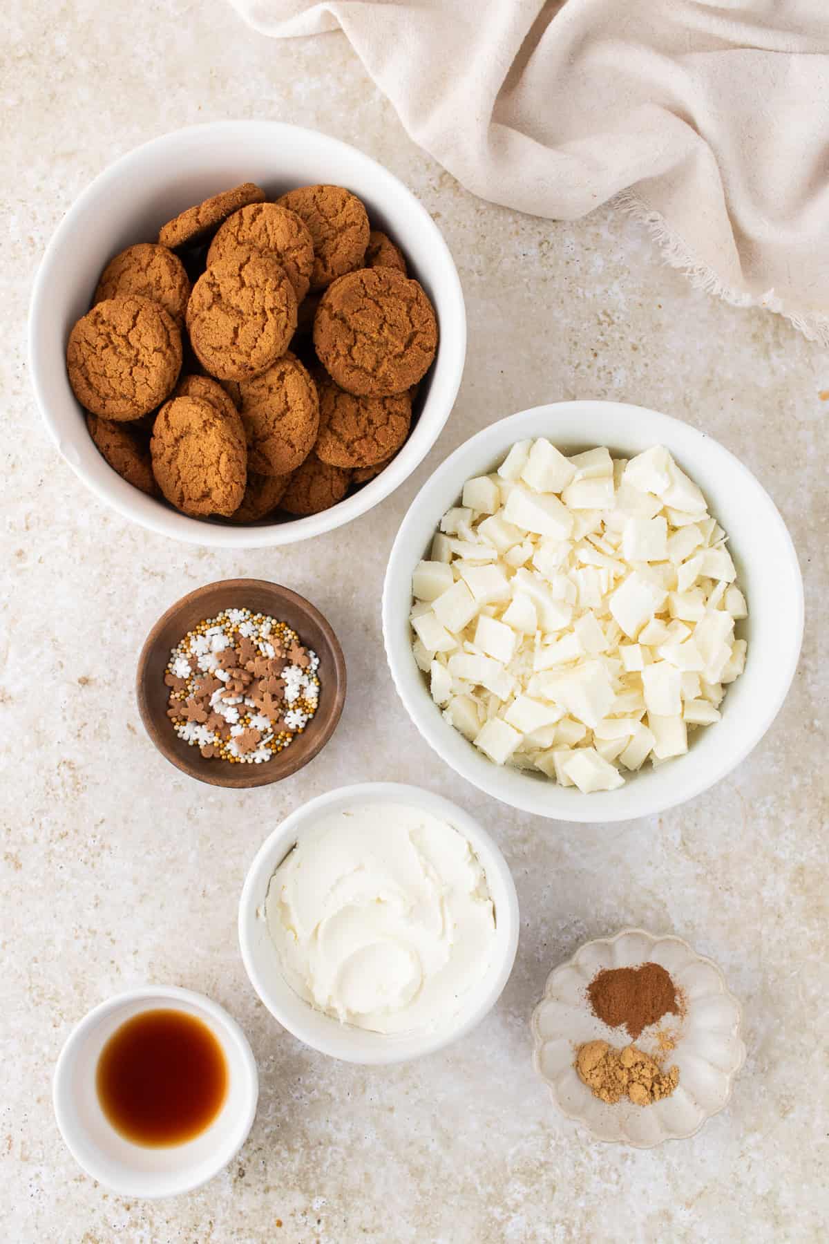 ingredients for the gingerbread truffles in small white bowls. 