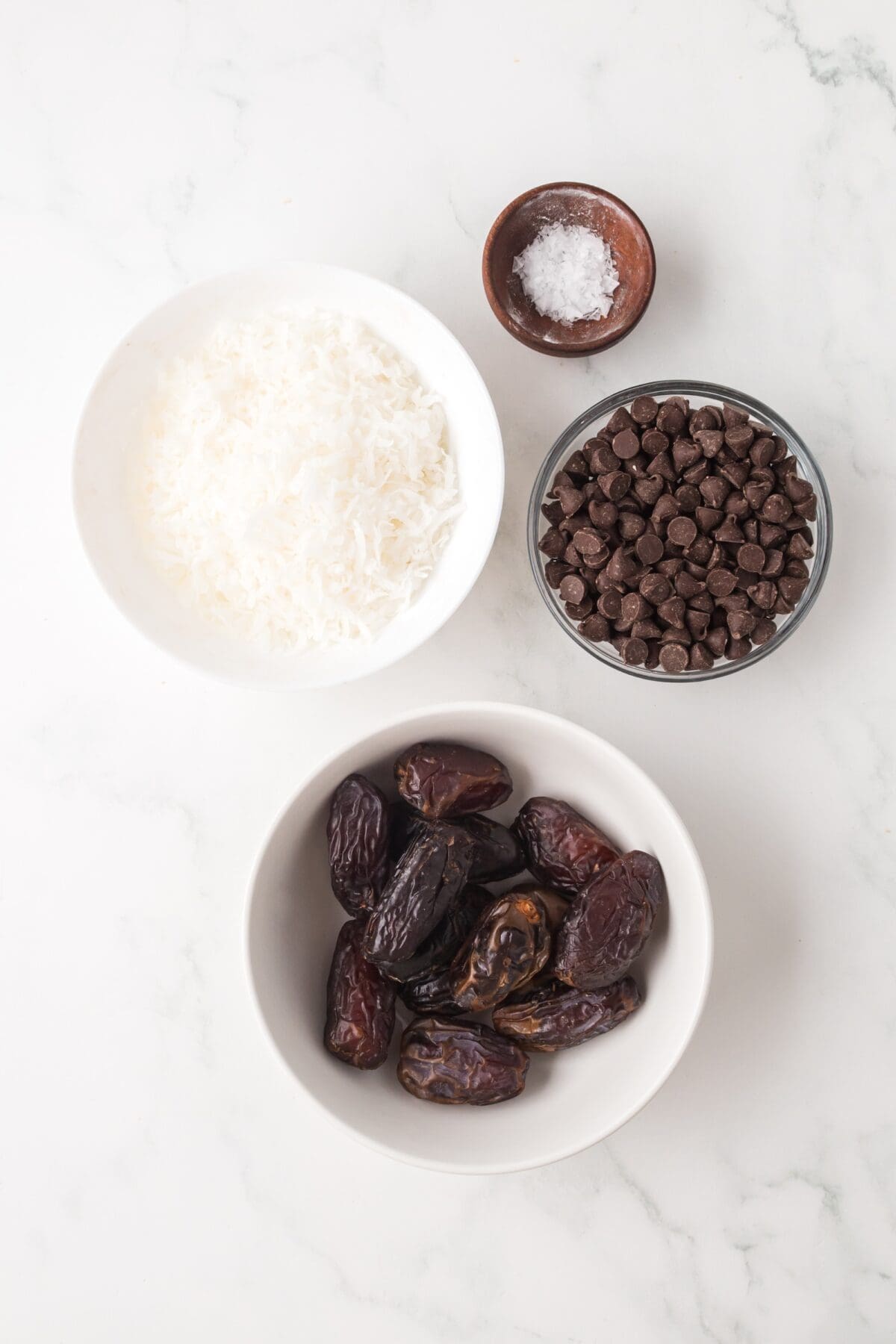 ingredients for the date Samoas in small bowls. 