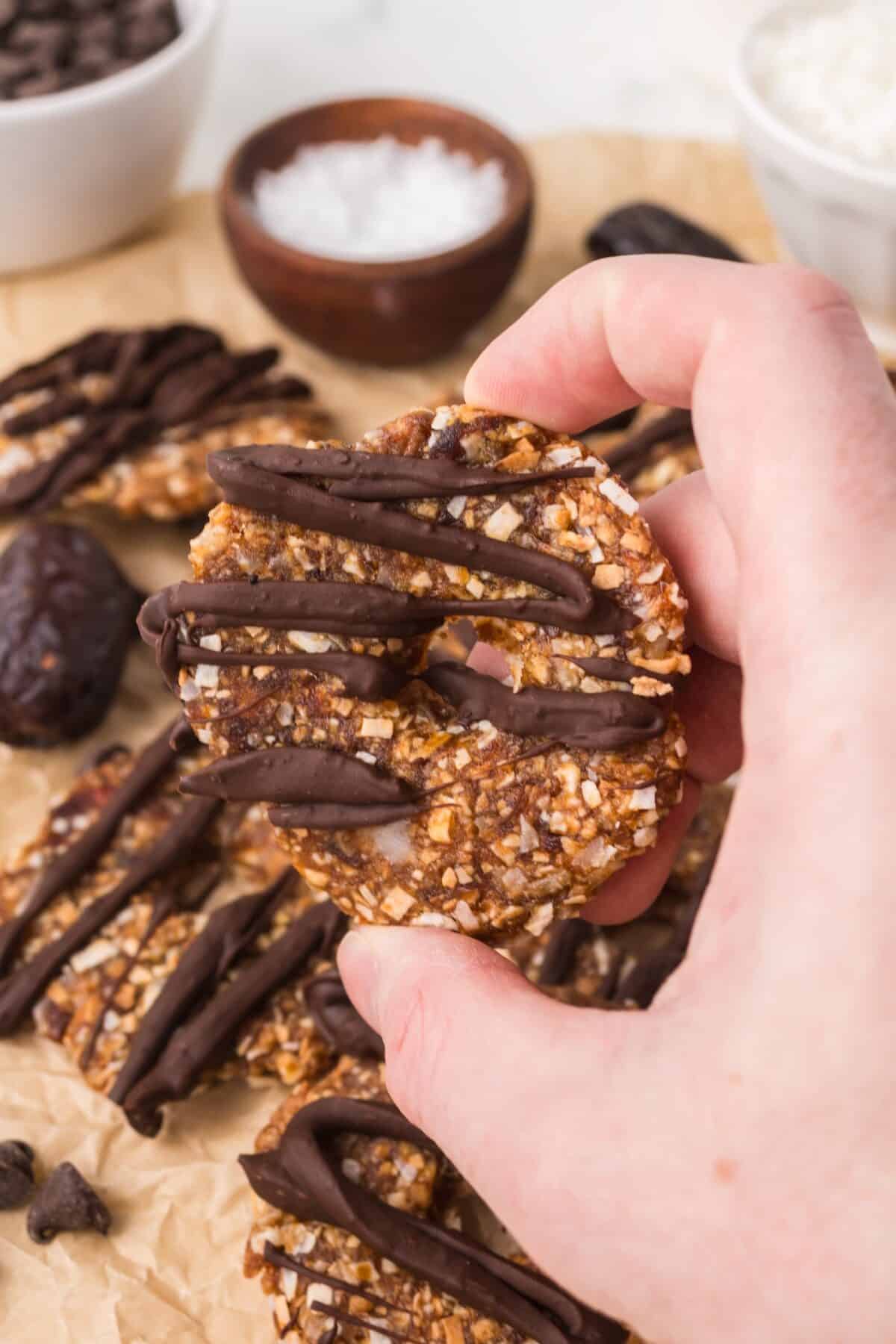 holding one of the date Samoas in hand to show texture. 