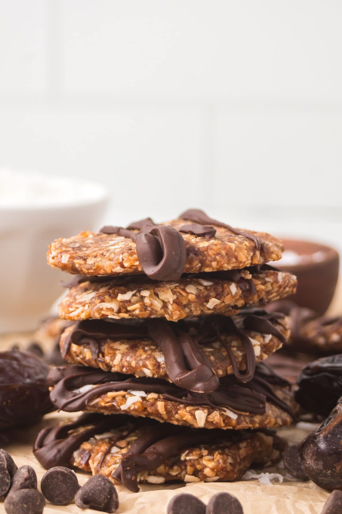 stack of finished date Samoas on parchment paper.