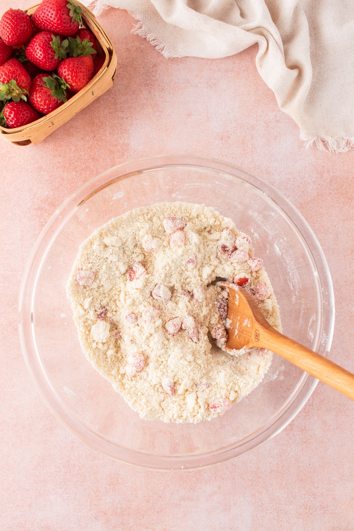 mixing bowl with fresh strawberries mixed into the flour butter mixture. 